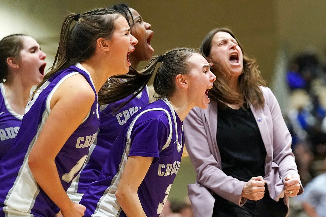 Photographer Cindy Schultz won a first-place Catholic Press Association Award for this photo of the Catholic Central girls’ basketball team.