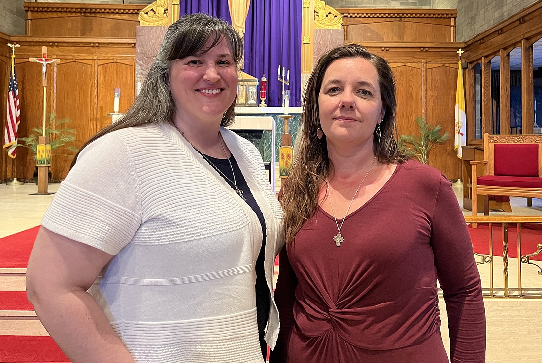 Katie Grogan (l.) and Shaunda Penny stand in front of the altar space at St. Paul the Apostle Church in Schenectady. The pair has started a Miscarriage Ministry in the Diocese of Albany to offer emotional support and logistical guidance for women and families who’ve been touched by miscarriage. (Emily Benson photo)