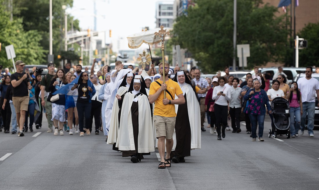 Pilgrims on the final leg of the National Eucharistic Pilgrimage's Seton Route, which launched May 18 in New Haven, Conn., arrive for a welcome Mass at St. John the Evangelist Church in Indianapolis July 16, 2024, just head of the National Eucharistic Congress. (OSV News photo/Bob Roller)