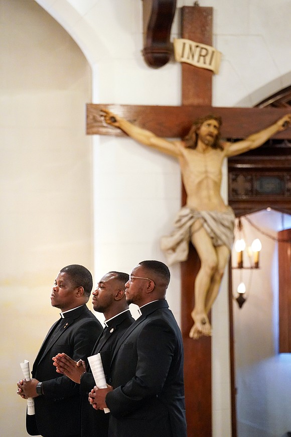 Candidates Samuel Zuze (from l.) Zephyrinus Ogbenna and Franklin Anyanechi are shown during their Rite of Candidacy on Aug. 1 at Holy Trinity Church in Cohoes.  (Cindy Schultz photo for The Evangelist)