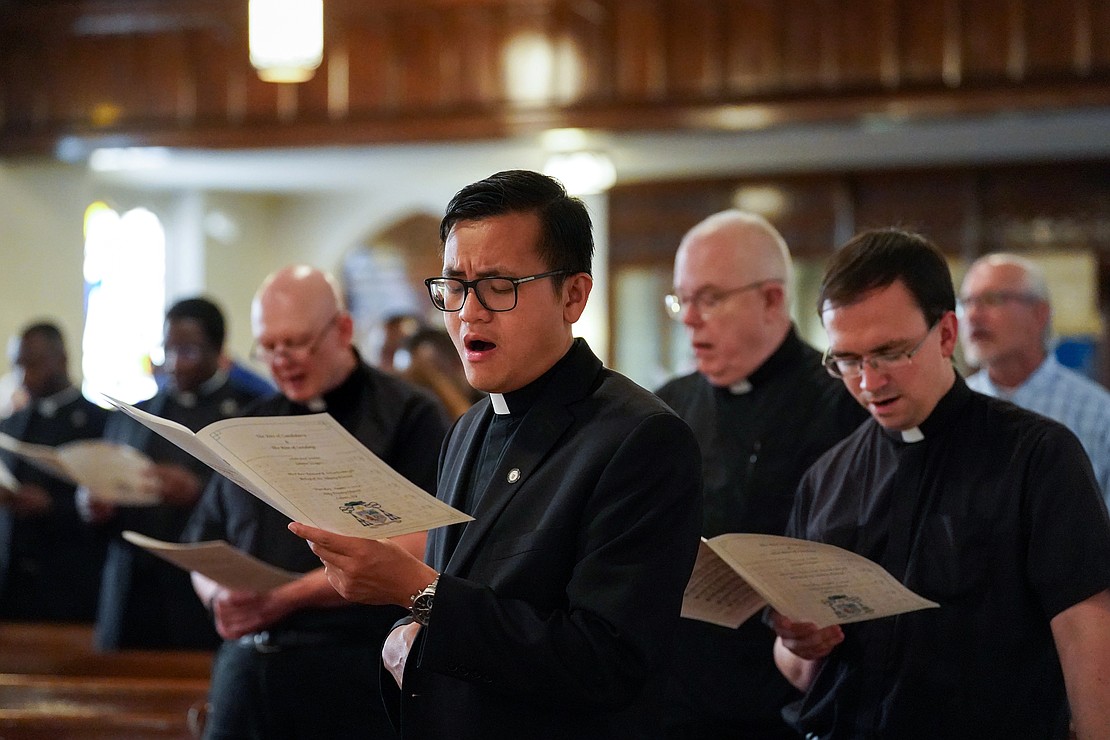 Seminarian Vantuan Cao (c.) sings during the Rite of Candidacy and the Rite of Sending on Aug. 1 at Holy Trinity Church in Cohoes. (Cindy Schultz photo for The Evangelist)