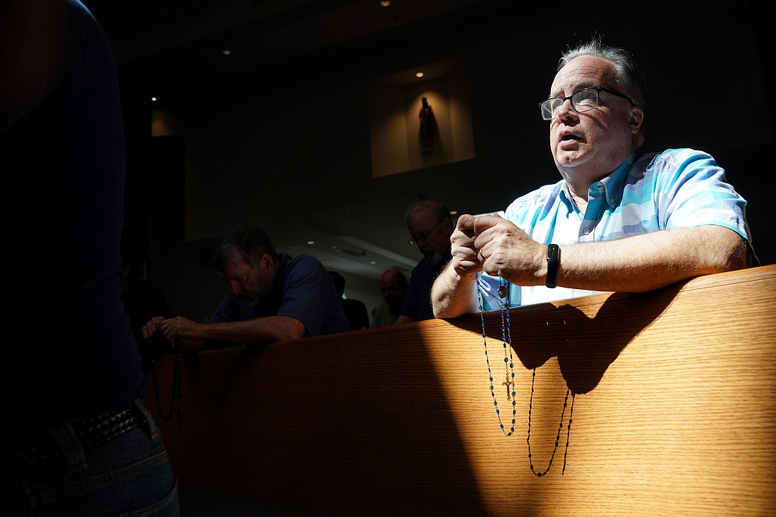 Fred Shellard, a parishioner at St. Pius X in Loudonville, prays with the rosary during the Step Up Men’s Conference on Saturday, Aug. 10, 2024, at St. Edward the Confessor in Clifton Park, N.Y.  Cindy Schultz for The Evangelist