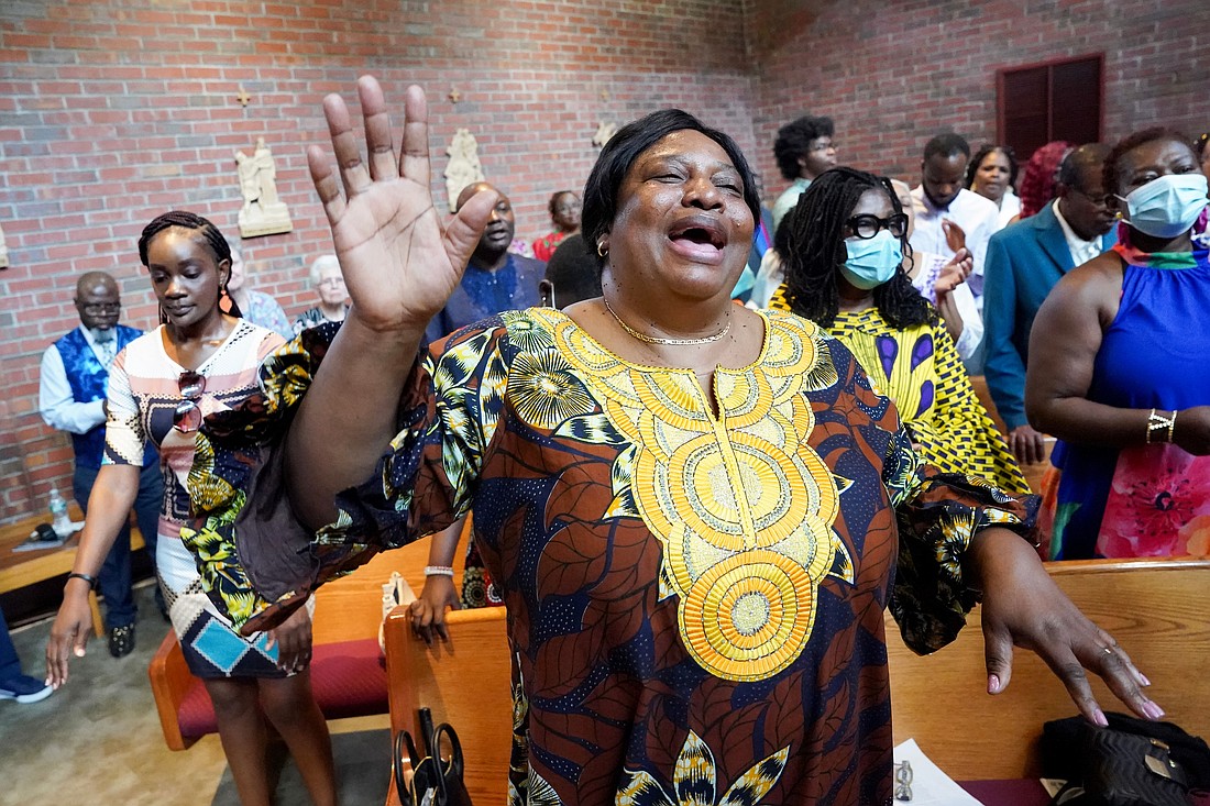 Joelle Mukendi, center, sings during mass to celebrate the 40th anniversary of the Black Catholic Apostolate on Sunday, Aug.11, 2024, at St. Joan of Arc in Menands, N.Y.  Cindy Schultz for The Evangelist