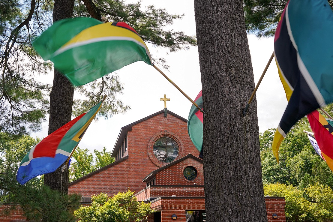 Flags from African nations fly outside of the home of the Black Catholic Apostolate on Sunday, Aug.11, 2024, at St. Joan of Arc in Menands, N.Y.  Cindy Schultz for The Evangelist