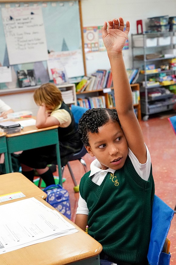 Channing Takach responds to a question in fourth-grade Creative Arts class on Sept. 11 at Mater Christi School in Albany. (Cindy Schultz photo for The Evangelist)