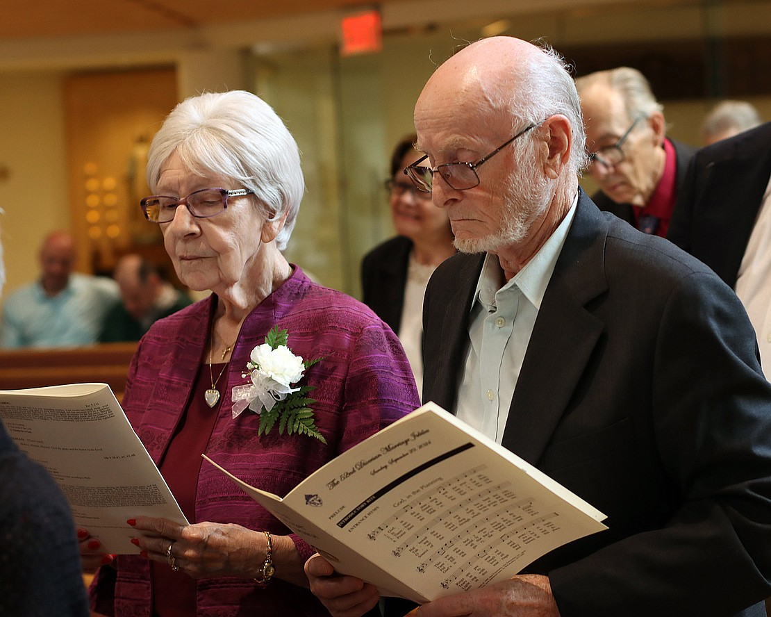 Gloria and John Joyce of Frankfort, married 60 years, renew their vows during the 52nd Annual Diocesan Marriage Jubilee Celebration at Christ Our Light Church on Sept. 29. (Tom Killips photo)