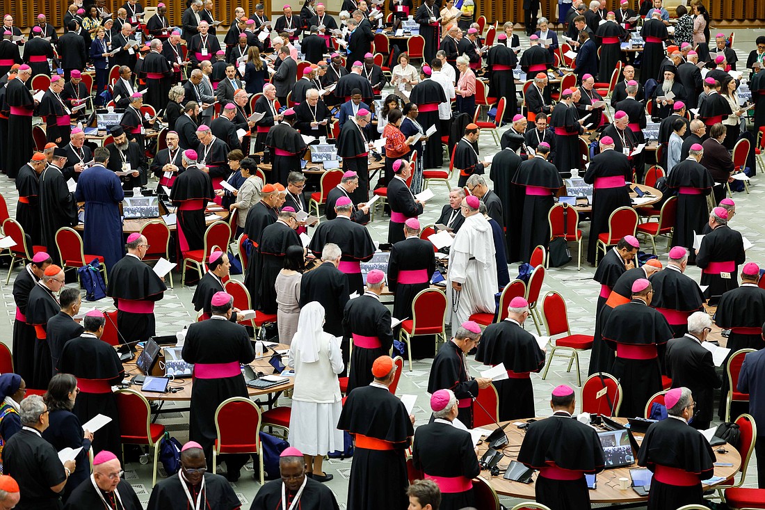 Participants in the assembly of the Synod of Bishops gather in the Paul VI Audience Hall at the Vatican to pray before the opening session Oct. 2, 2024. (CNS photo/Lola Gomez)