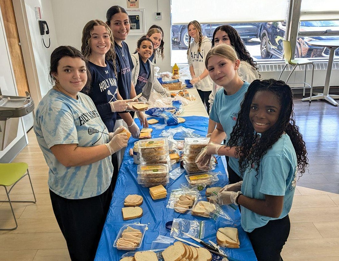 The Academy of Holy Names students, faculty and staff spent Oct. 3 volunteering at 18 different service organizations around the Capital District. (Photos provided)