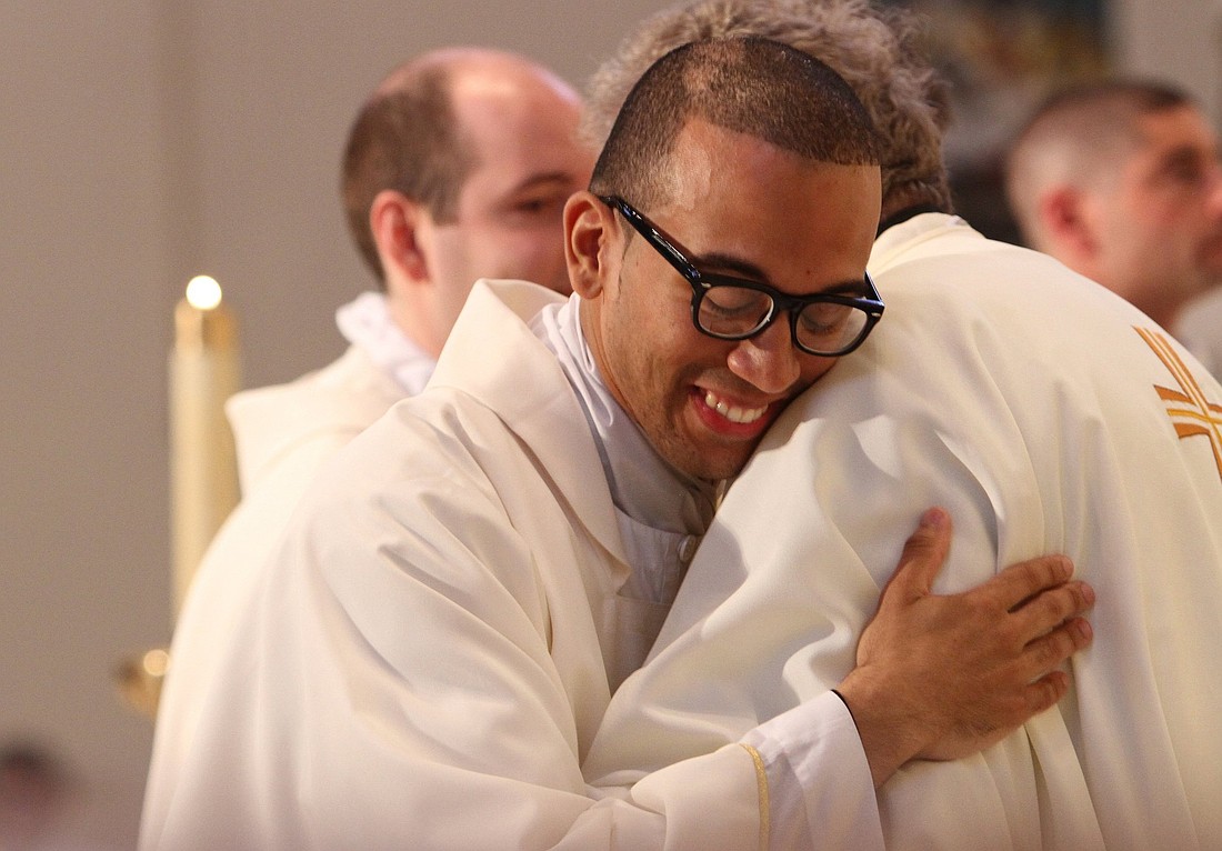 Priests are pictured in a file photo exchanging the sign of peace during ordination at St. Agnes Cathedral in Rockville Centre, N.Y.  (OSV News photo/Gregory A. Shemitz, Long Island Catholic)