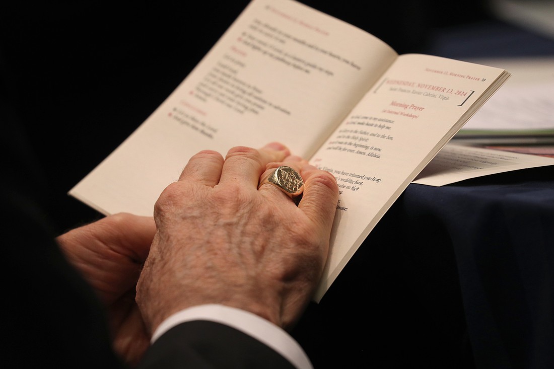 The ring of Bishop Gerald M. Barbarito of Palm Beach, Fla., is seen as he prays during a Nov. 12, 2024, session of the fall general assembly of the U.S. Conference of Catholic Bishops in Baltimore. (OSV News photo/Bob Roller)