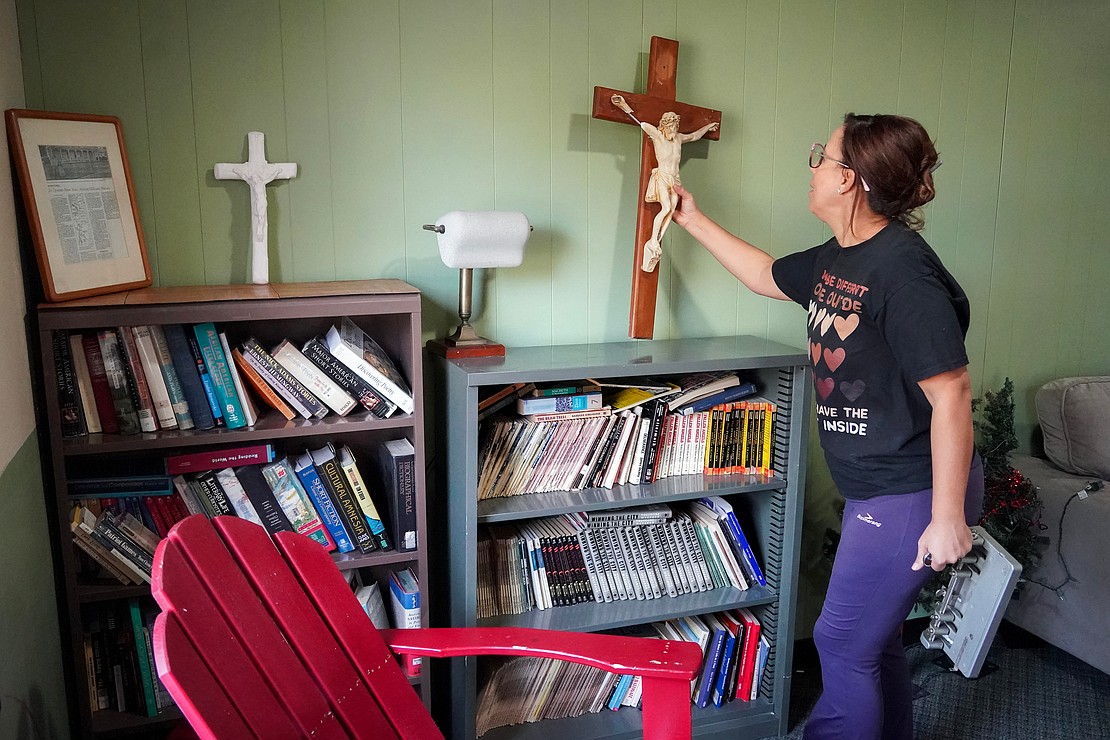 NOTRE DAME-BISHOP GIBBONS SCHOOL (SCHENECTADY): Mouna Aouini, NDBG Spanish teacher, cleans and rearranges the faculty lounge during a Day of Service on Nov. 5 at Notre Dame-Bishop Gibbons School. (Cindy Schultz photo for The Evangelist)