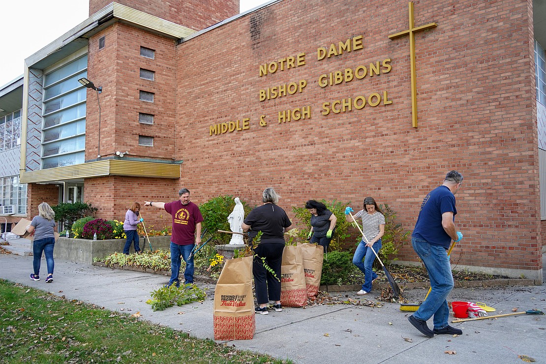 NOTRE DAME-BISHOP GIBBONS SCHOOL (SCHENECTADY): Catholic School Office staff and NDBG teachers clean up school grounds during a Day of Service on Nov. 5 at Notre Dame-Bishop Gibbons School. (Cindy Schultz photo for The Evangelist)