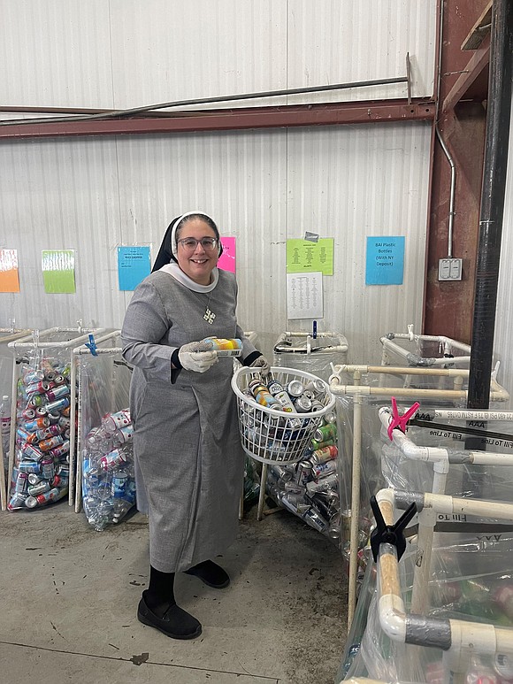 ST. JUDE THE APOSTLE (WYNANTSKILL): The faculty spent Nov. 5 sorting bottles and cans for the Hudson Mohawk Humane Society. The organization makes about $200,000 a year by turning in donated cans and bottles. (Photo provided)