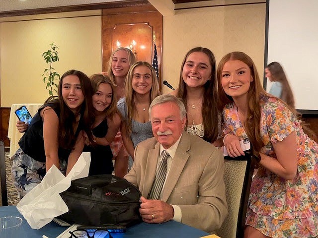 Carlo Cherubino, a beloved coach and teacher at the Academy of the Holy Names, died Nov. 14 at Samaritan Hospital in Troy, after a brief illness. He is pictured here with fellow AHN students. (Provided photo)