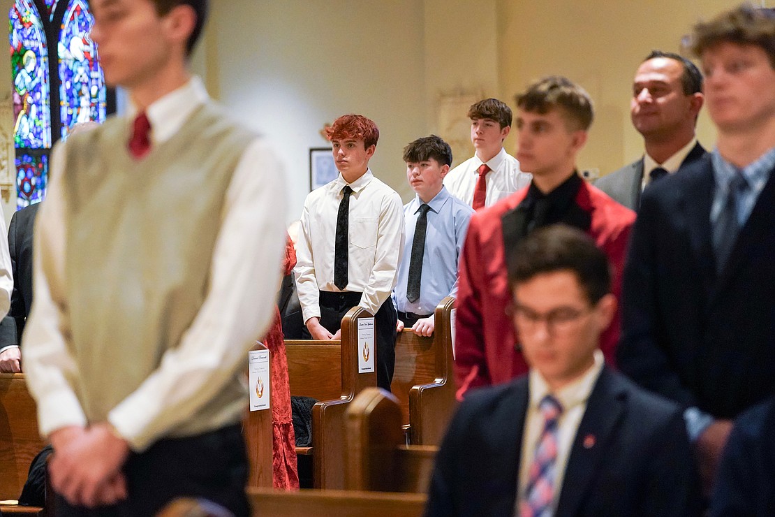 Candidates for confirmation stand as they are recognized on Nov. 23 at the Church of the Holy Spirit in East Greenbush. (Cindy Schultz photo for The Evangelist)