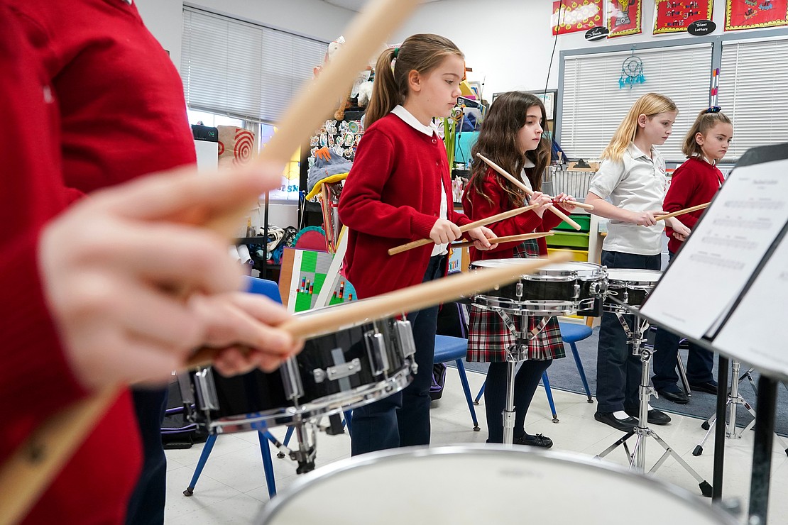 Third and fourth graders practice snare drums during music class on Jan. 16 at Holy Spirit School in East Greenbush. (Cindy Schultz photo for The Evangelist)