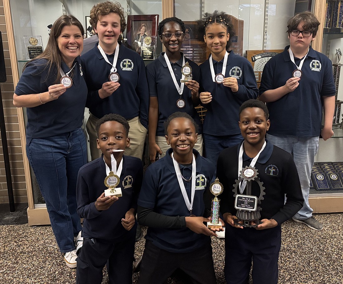 Katie O'Connor, (back row, l.) director of technology for Blessed Sacrament School, is joined by Nolan Moore, Annabelle Ackah-Miezah, Isabella Dalzell, Jake Atiken, and Nathan Makate, (front row, l.), Kevin George and Davis Koudakpo as they pose with their medals after taking home third place in the regional Future City competition.(Photos provided)