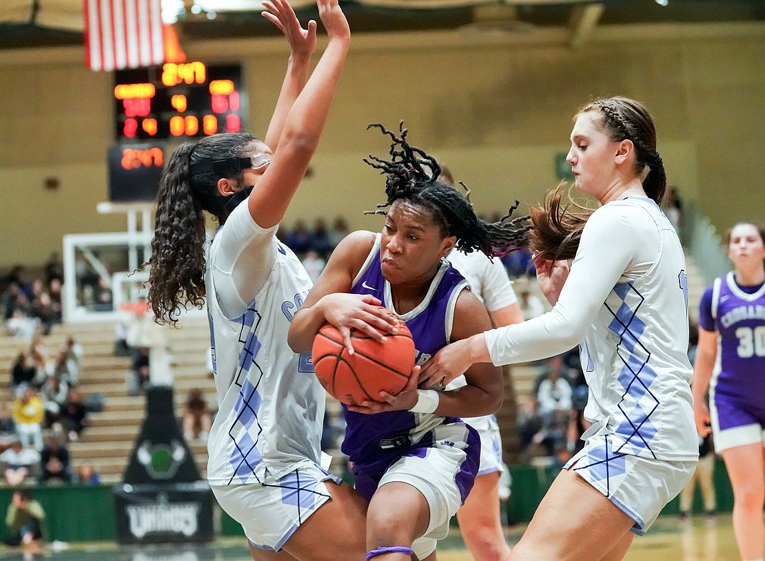 Catholic Central’s El’Dior Dobere threads the needle as she heads for the hoop during the Crusaders' Section II Class AA final basketball game on March 10 at Hudson Valley Community College in Troy. (Cindy Schultz photo for The Evangelist)