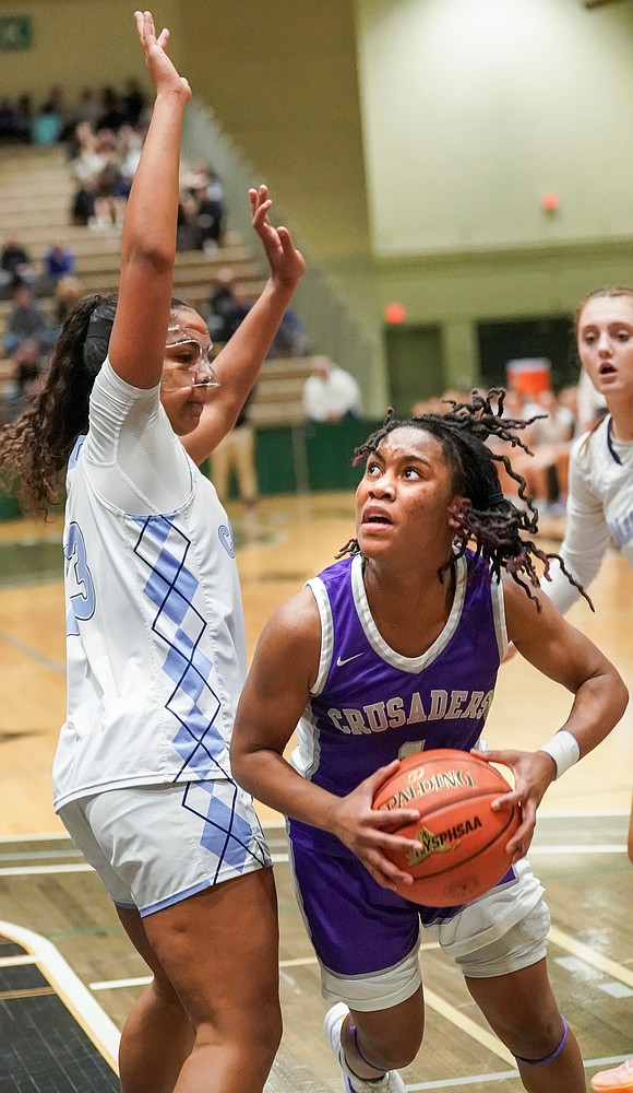 Catholic Central’s El’Dior Dobere looks to get around Columbia’s Alivia Landy during the Crusaders' Section II Class AA final basketball game on March 10 at Hudson Valley Community College in Troy. (Cindy Schultz photo for The Evangelist)