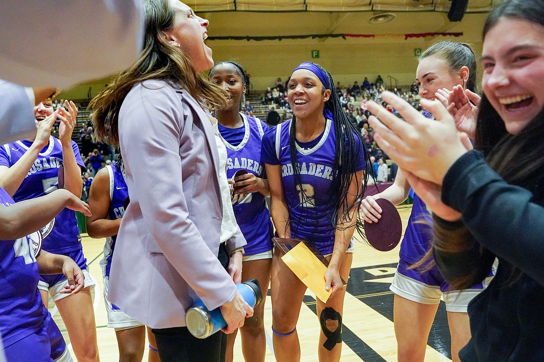 Catholic Central School head coach Audra DiBacco and her team celebrate a 64-63 win over Columbia during their Section II Class AA final basketball game on March 10 at Hudson Valley Community College in Troy. (Cindy Schultz photo for The Evangelist)