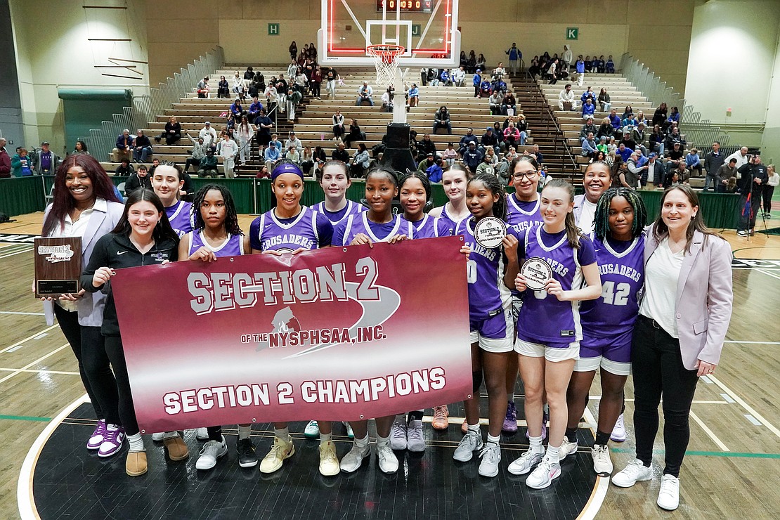 The Catholic Central School girls' basketball team celebrates a 64-63 win over Columbia during their Section II Class AA final basketball game on March 10 at Hudson Valley Community College in Troy. (Cindy Schultz photo for The Evangelist)