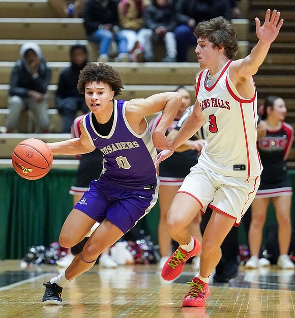 Catholic Central’s Sei'Mir Roberson moves the ball as Glens Falls’ Brody Holcomb defends during the Crusaders' Section II Class A final basketball game against Glens Falls on March 8, at Hudson Valley Community College in Troy. Glens Falls won 93-59. (Cindy Schultz photo for The Evangelist)