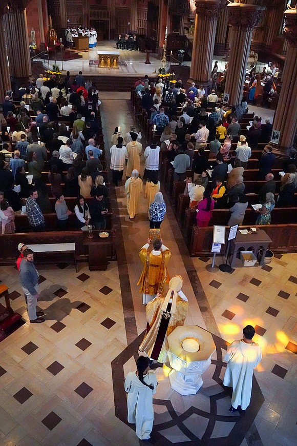 Bishop Edward B. Scharfenberger and his clergy process to the altar for Easter Mass on April 20 at the Cathedral of the Immaculate Conception in Albany. (Cindy Schultz photo for The Evangelist)