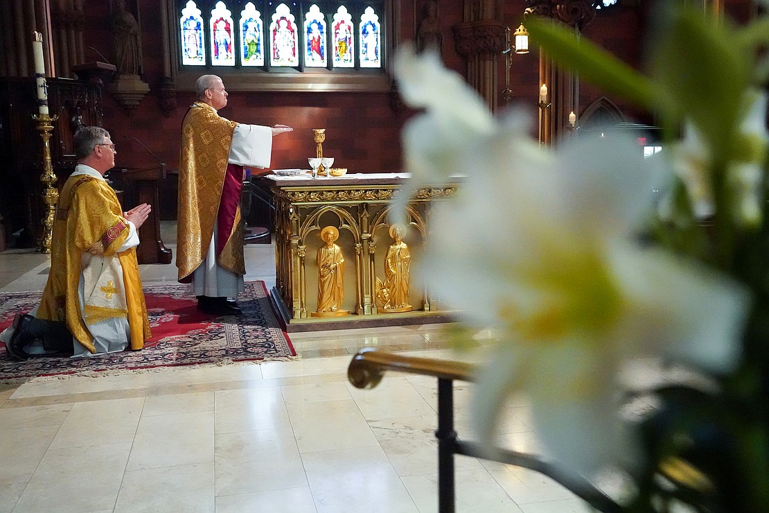 Bishop Edward B. Scharfenberger leads the consecration of the gifts during Easter Mass on April 20 at the Cathedral of the Immaculate Conception in Albany. (Cindy Schultz photo for The Evangelist)
