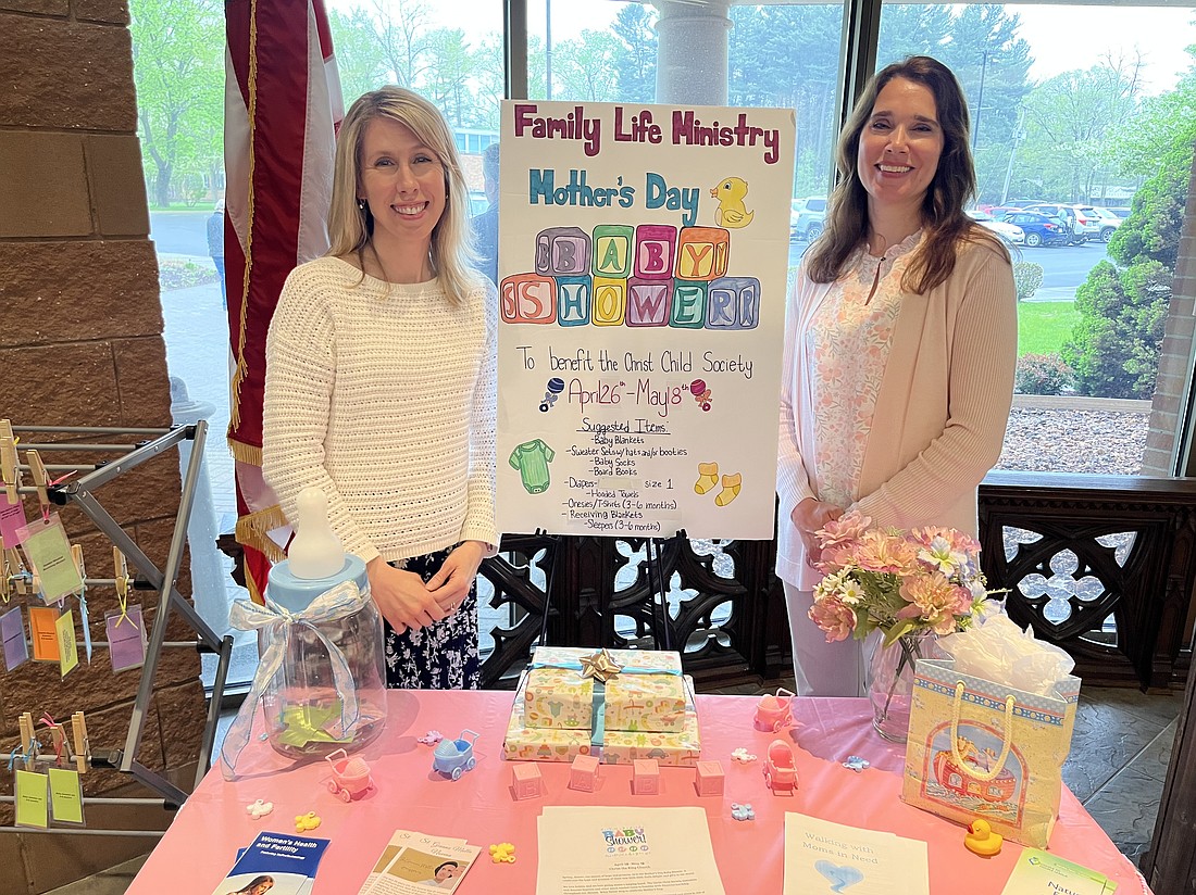 Kate Lansing (l.) and Vicky Myers, parishioners at Christ the King Church in Westmere, both helped organize the Mother’s Day Baby Shower event for their church. (Emily Benson photos)