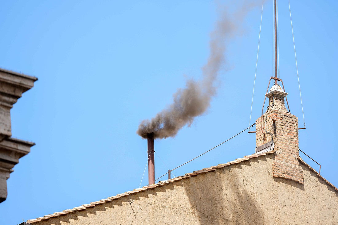 Black smoke billows from the chimney on the Sistine Chapel May 8, 2025, on the second day of the conclave. (CNS Photo/Lola Gomez)