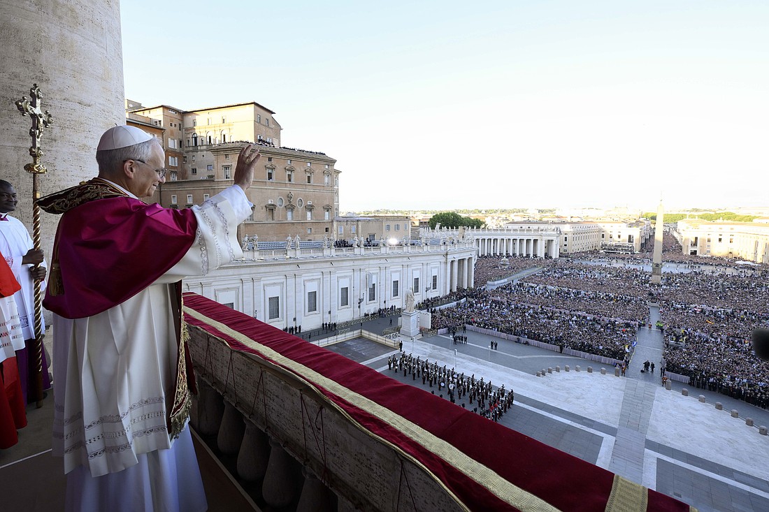 Pope Leo XIV, the former Cardinal Robert F. Prevost, waves to the crowds in St. Peter's Square at the Vatican after his election as pope May 8, 2025. The new pope was born in Chicago. (CNS photo/Vatican Media)