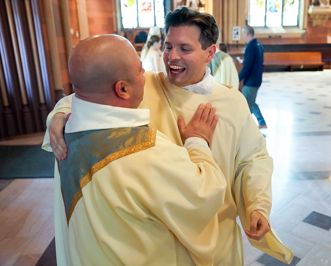 Newly ordained deacon Alexander Turpin (r.) celebrates with Father Kyle Gorenski following his Ordination to the Diaconate on May 17 at the Cathedral of the Immaculate Conception in Albany. (Cindy Schultz for The Evangelist)