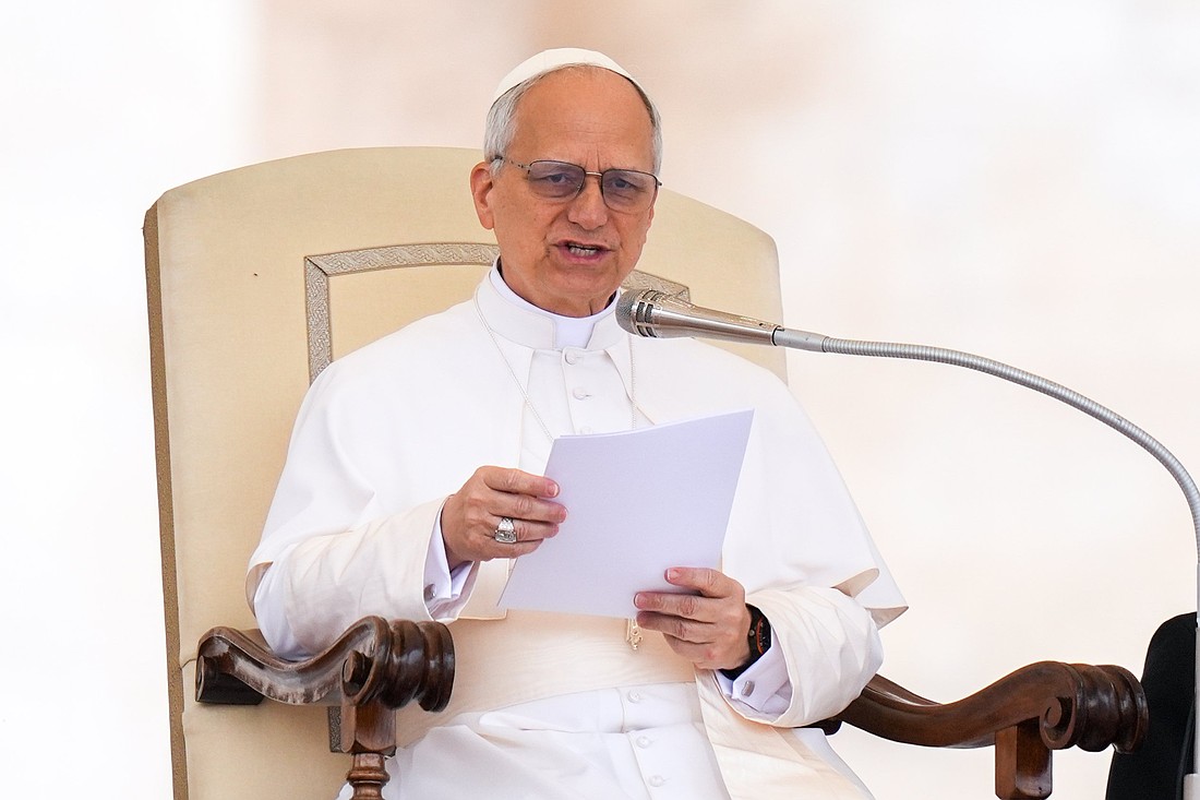 Pope Leo XIV talks to visitors during his first weekly general audience in St. Peter's Square at the Vatican May 21, 2025. (CNS photo/Lola Gomez)