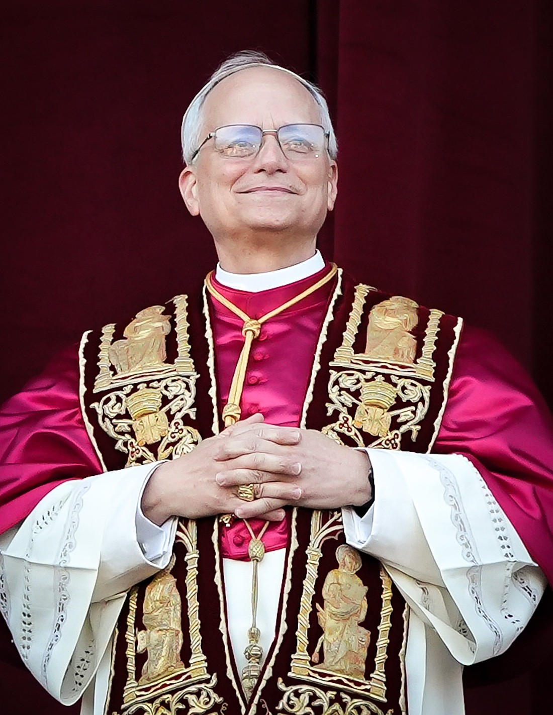 Pope Leo XIV, formerly Cardinal Robert F. Prevost, smiles as he appears at the central loggia of St. Peter’s Basilica at the Vatican following his election as pope May 8, 2025. The new pope was born in Chicago. (CNS photo/Lola Gomez)