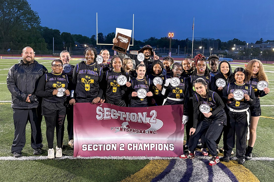 Holy Trinity celebrates their Section II Class C flag football championship on May 22 at Troy High School in Troy. The Pride beat Broadalbin-Perth, 19-0. (Cindy Schultz photo for The Evangelist)