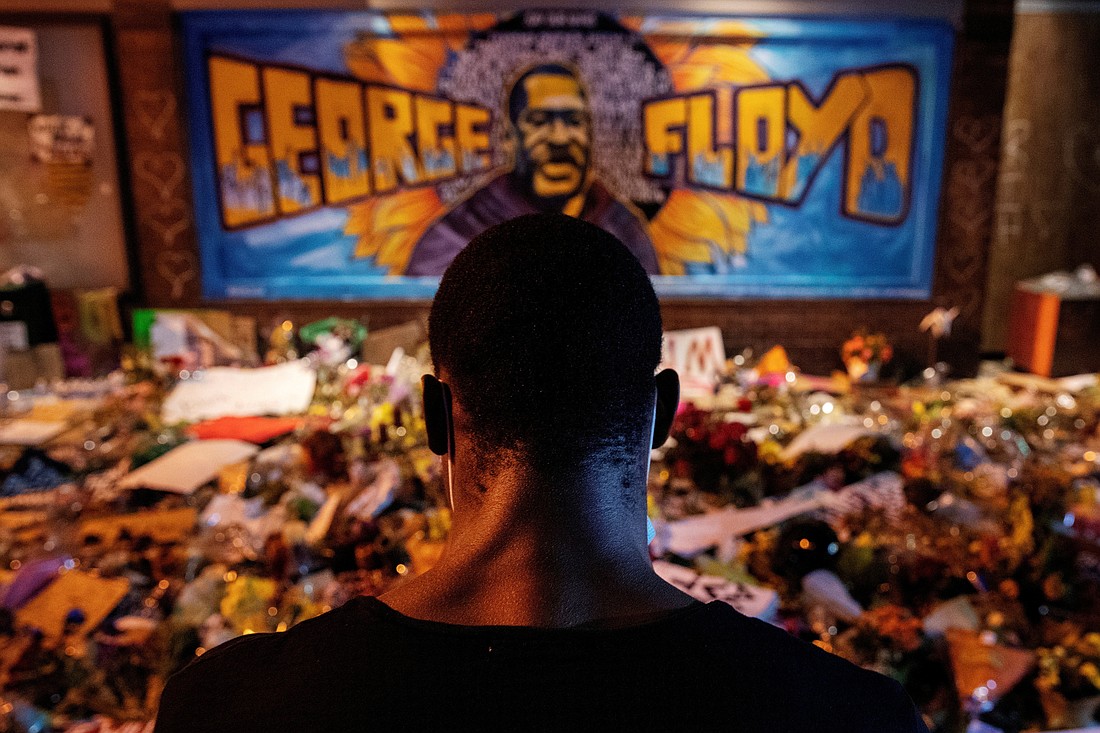 A man in Minneapolis recites poetry at a makeshift memorial honoring George Floyd June 1, 2020. Floyd, an unarmed Black man, was pinned down by now ex-police officer Derek Chauvin kneeling on his neck before later dying in the hospital May 25, 2020. Jury selection in Chauvin's trial began March 8, 2021. (CNS photo/Lucas Jackson, Reuters)