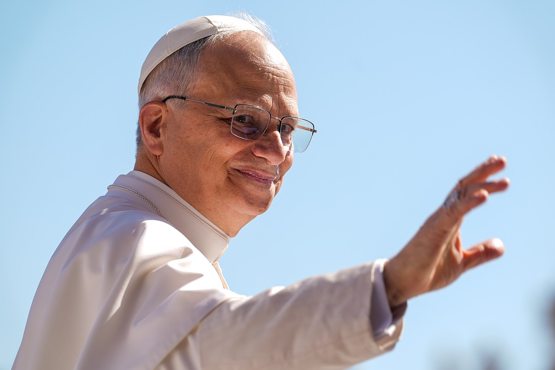 Pope Leo XIV waves as he rides the popemobile around St. Peter’s Square at the Vatican May 28, 2025, ahead of his second weekly general audience. (CNS photo/Lola Gomez)