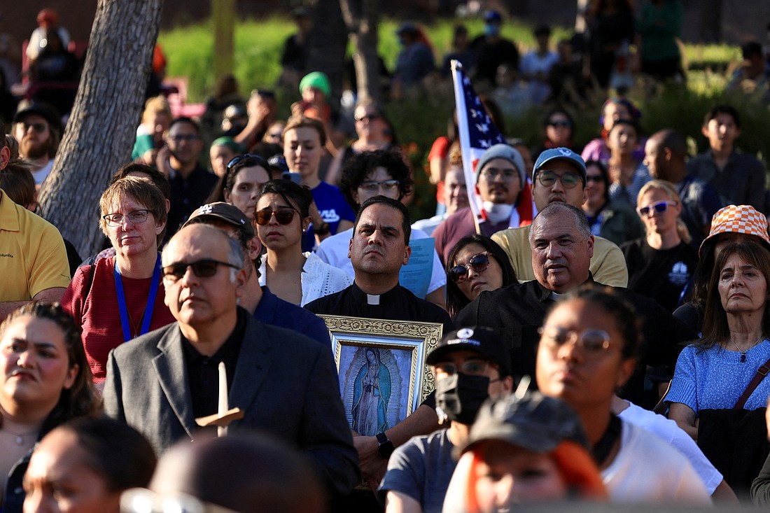 A member of the clergy holding an image of Our Lady of Guadalupe attends a vigil in Grand Park in downtown Los Angeles June 10, 2025, as protests against federal immigration sweeps continue. (OSV News photo/David Swanson, Reuters)