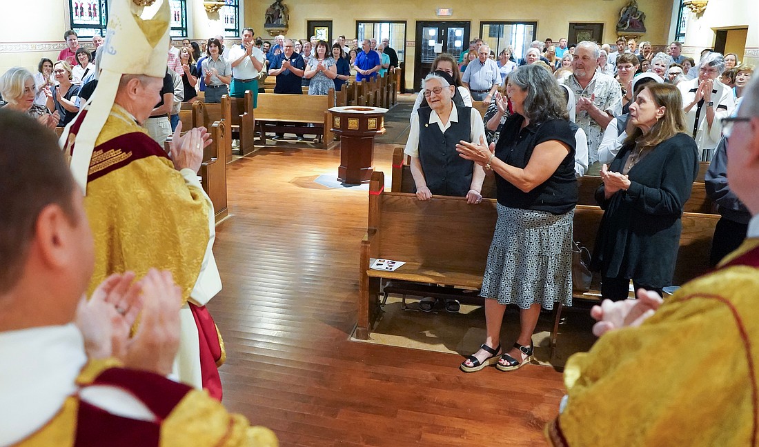 Bishop Edward B. Scharfenberger, the clergy and the congregation join in to sing “Happy Birthday” to Sister Maria Rosa Querini, center, during a special mass to celebrate her 90th birthday on Sunday, June 22, 2025, at St. Anthony’s Church in Schenectady, N.Y.  Cindy Schultz for The Evangelist