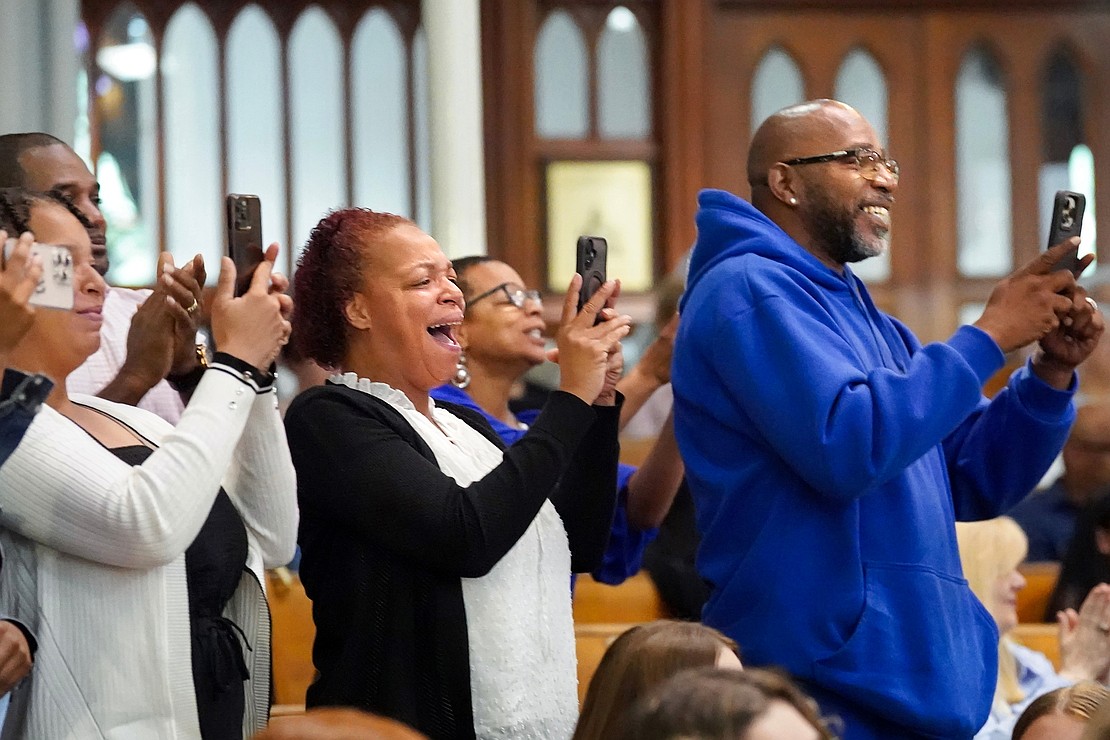 Family members take photos as graduates receive their diplomas during Notre Dame–Bishop Gibbons' Commencement Exercises on June 7 at St. John the Evangelist in Schenectady. (Cindy Schultz photo for The Evangelist)
