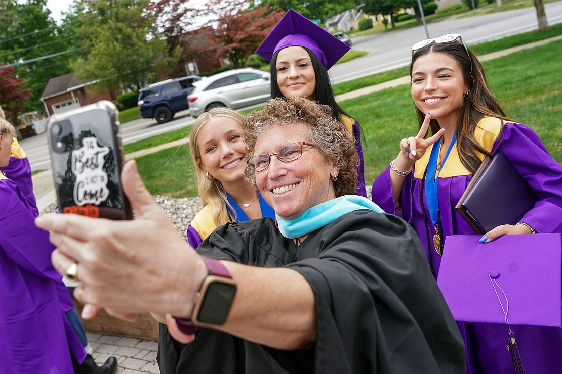 Middle School assistant principal Maria Izzo, center, takes a selfie with graduates following Saratoga Catholic Central’s commencement exercises on Friday June 27, 2024, at St. Clement’s Church in Saratoga Springs, N.Y.  Cindy Schultz for The Evangelist