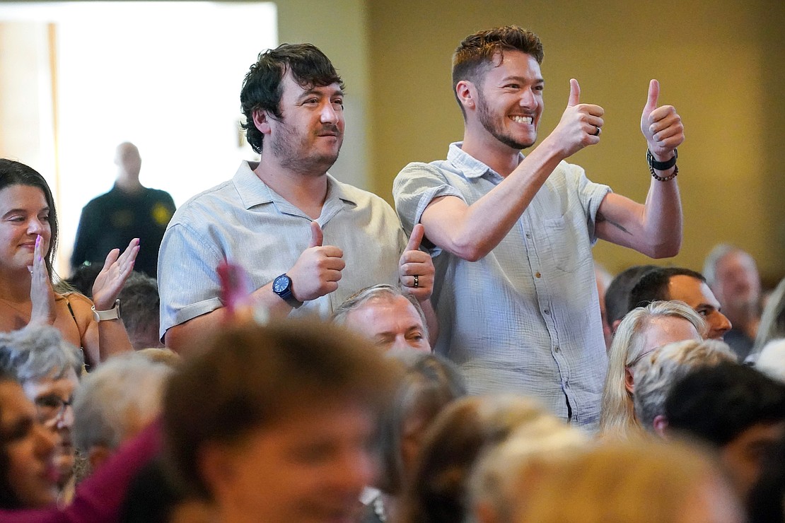 Brothers Joshua Sylvain, center, and Brandon Sylvain give thumbs up to their sister Emily Sylvain when she receives her diploma during Saratoga Catholic Central’s commencement exercises on Friday June 27, 2024, at St. Clement’s Church in Saratoga Springs, N.Y.  Cindy Schultz for The Evangelist