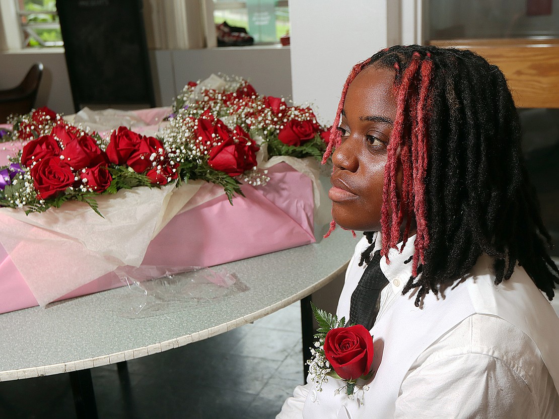 Brooklyn Moore wears her rose as she awaits Catholic Central's 102nd Commencement on June 7 at Russell Sage College in Troy. (Tom Killips photo)