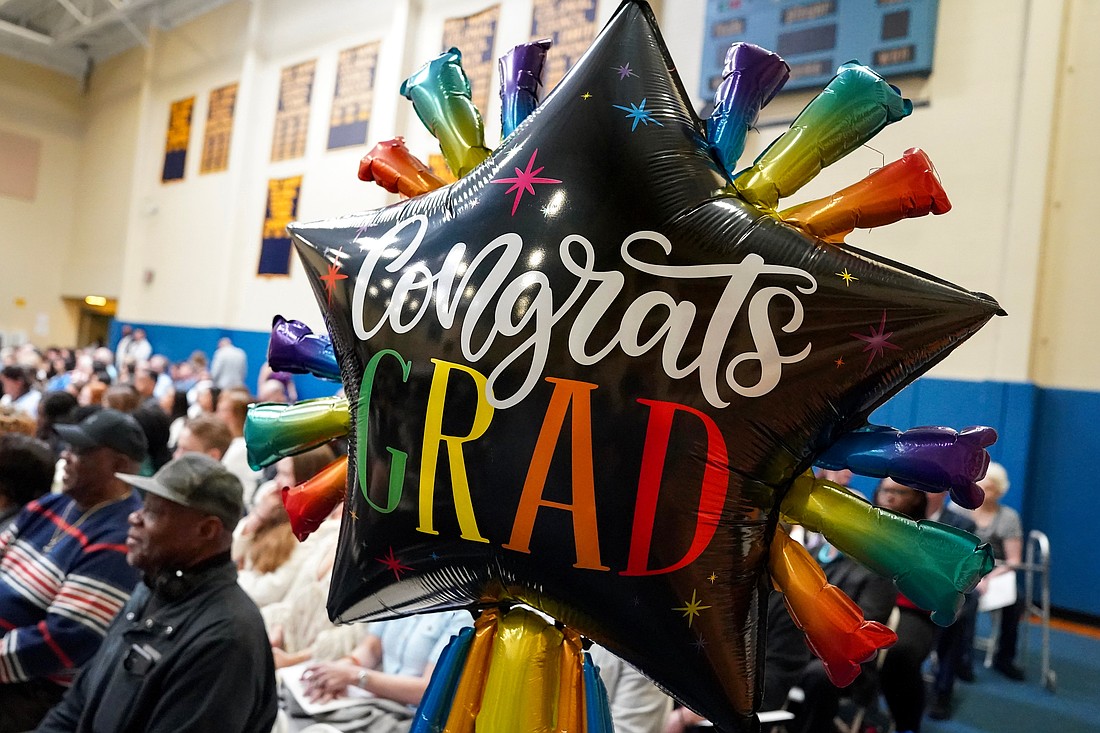 Family members have celebratory balloons ready for graduates at the commencement exercises on Friday May 23, 2024, at the Academy of the Holy Names in Albany, N.Y.  Cindy Schultz for The Evangelist