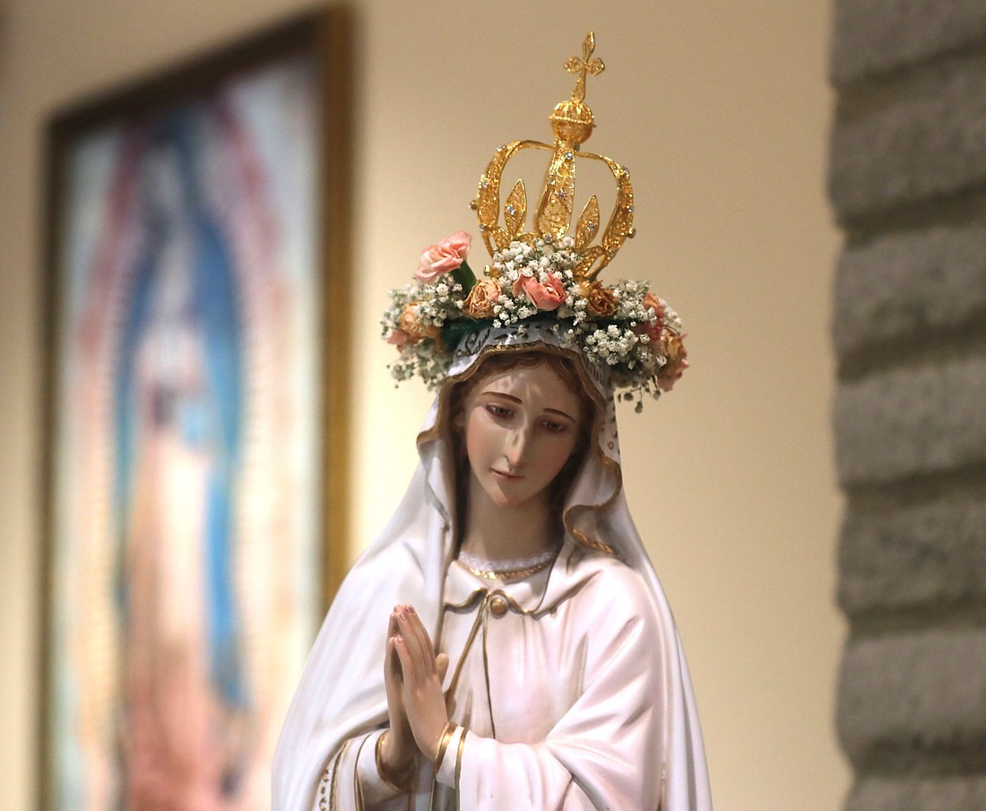 A statue of Mary with a crown, and a painting of Our Lady of Guadalupe are pictured at Sacred Heart Church in Prescott, Ariz., May 5, 2025. The month of May is devoted to Mary and is traditionally celebrated with a crowning and praying of the rosary. (OSV News photo/Bob Roller)