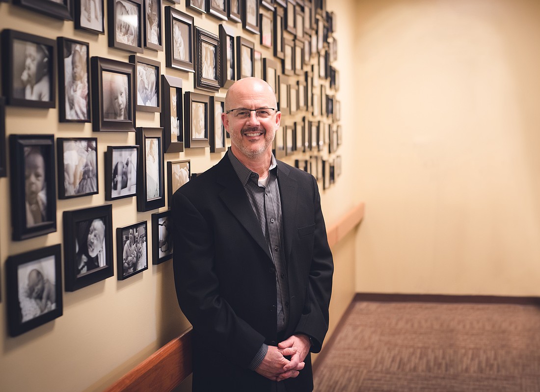 Dr. Christopher Stroud, pictured in an undated photo, is a board-certified OB-GYN who practices NaProTechnology and serves as the founder of Fertility & Midwifery Care Center and Holy Family Birth Center in Fort Wayne, Ind. He's a certified medical consultant with the Creighton Fertility Model. Multiple walls of his practice are covered with photos of his patients' children. (OSV News photo/courtesy Dr. Christopher Stroud)