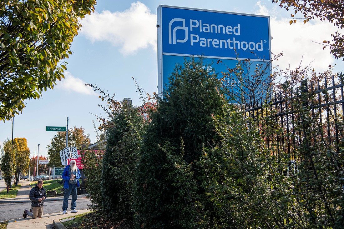 Protesters pray outside a Planned Parenthood location in Columbus, Ohio, Nov. 12, 2021. Whether or not Planned Parenthood will ultimately be stripped of its federal funding remained in question amid ongoing lawsuits over a provision in President Donald Trump’s legislative agenda that would cut those funds for one year. (OSV News photo/Gaelen Morse, Reuters)