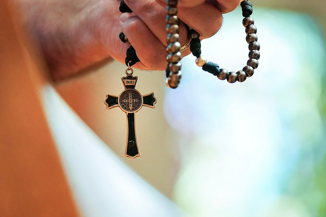 Participants pray with the rosary during the Step Up Men’s Conference on Saturday, Aug. 9, 2025, at St. Edward the Confessor in Clifton Park, N.Y.  Cindy Schultz for The Evangelist
