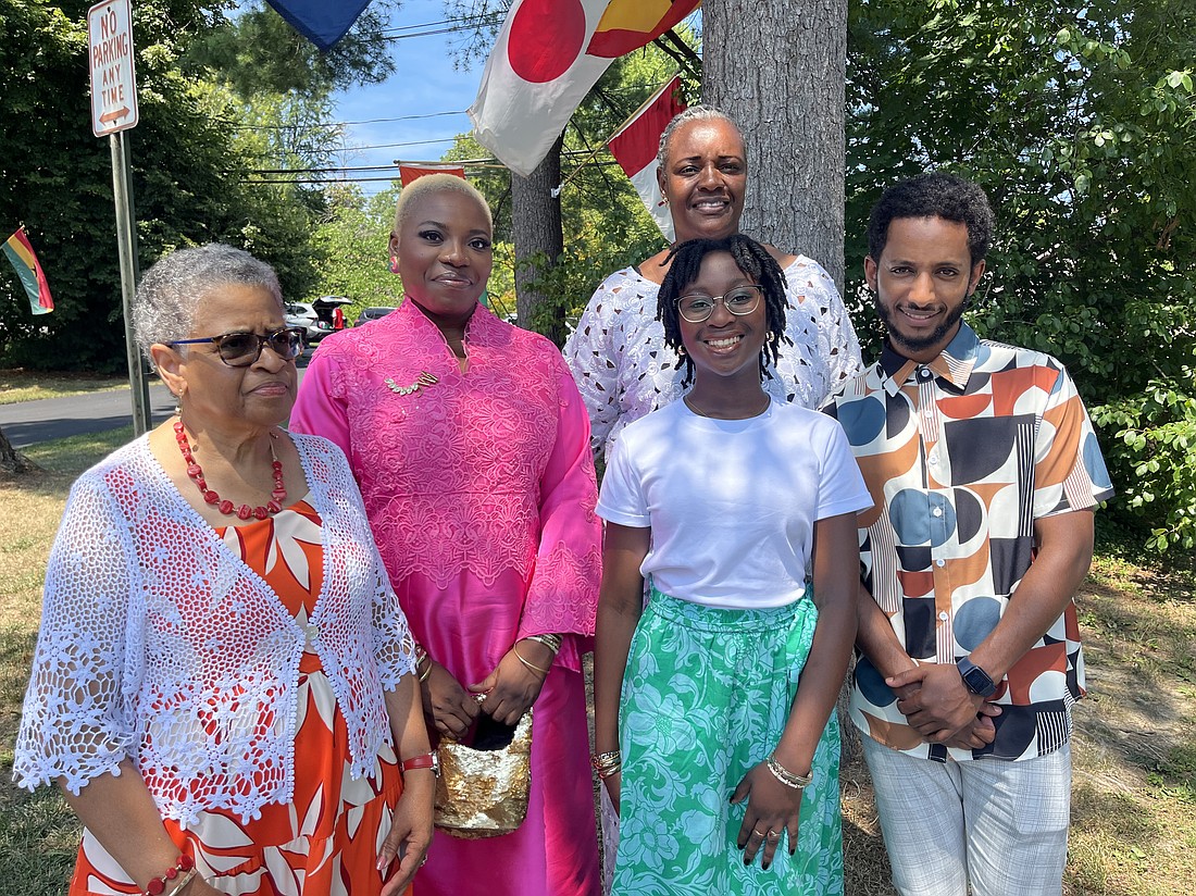 Brenda Rivera, Sarah Ukpere, Dr. Mbuyi Mukendi (back), Abigail Fiadjoe and Mesfin Solomon, parishioners at St. Joan of Arc and members of the Black Catholic Apostolate, attend their parish’s 41st anniversary Mass. (Emily Benson photo)