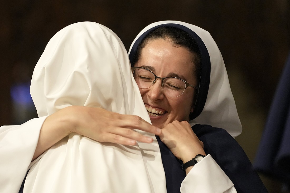 Sister of Life Maria Augustine hugs a member of her religious community during Mass at St. Patrick's Cathedral in New York City Aug. 6, 2025. Sister Maria was one of three Sisters of Life who professed their perpetual vows during the liturgy. (OSV News photo/Gregory A. Shemitz)
